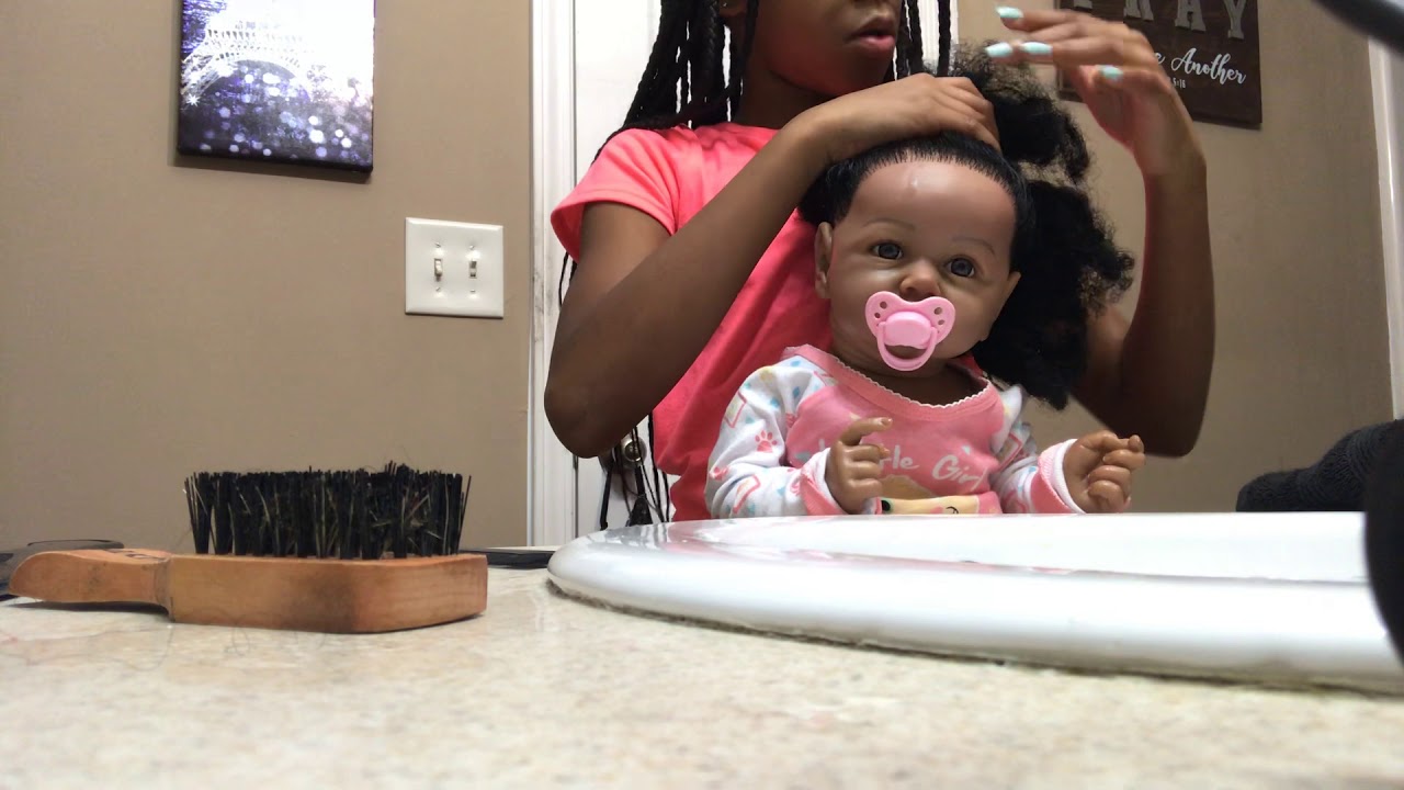 Doing my reborn baby’s hair!!!