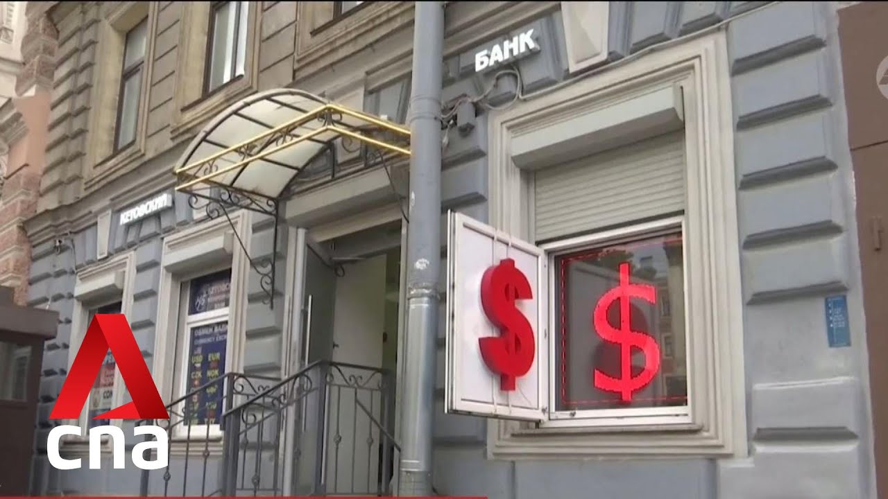 Russia rouble hits 16-month low, slipping past 100 per US dollar