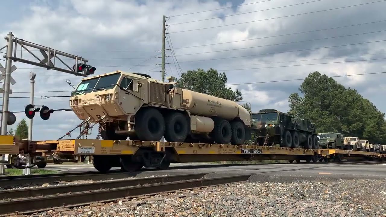 CSX #569 military freight train passing though lawrenceville