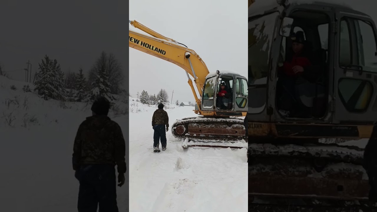 Буксировка  бульдозером неисправного экскаватора в гараж