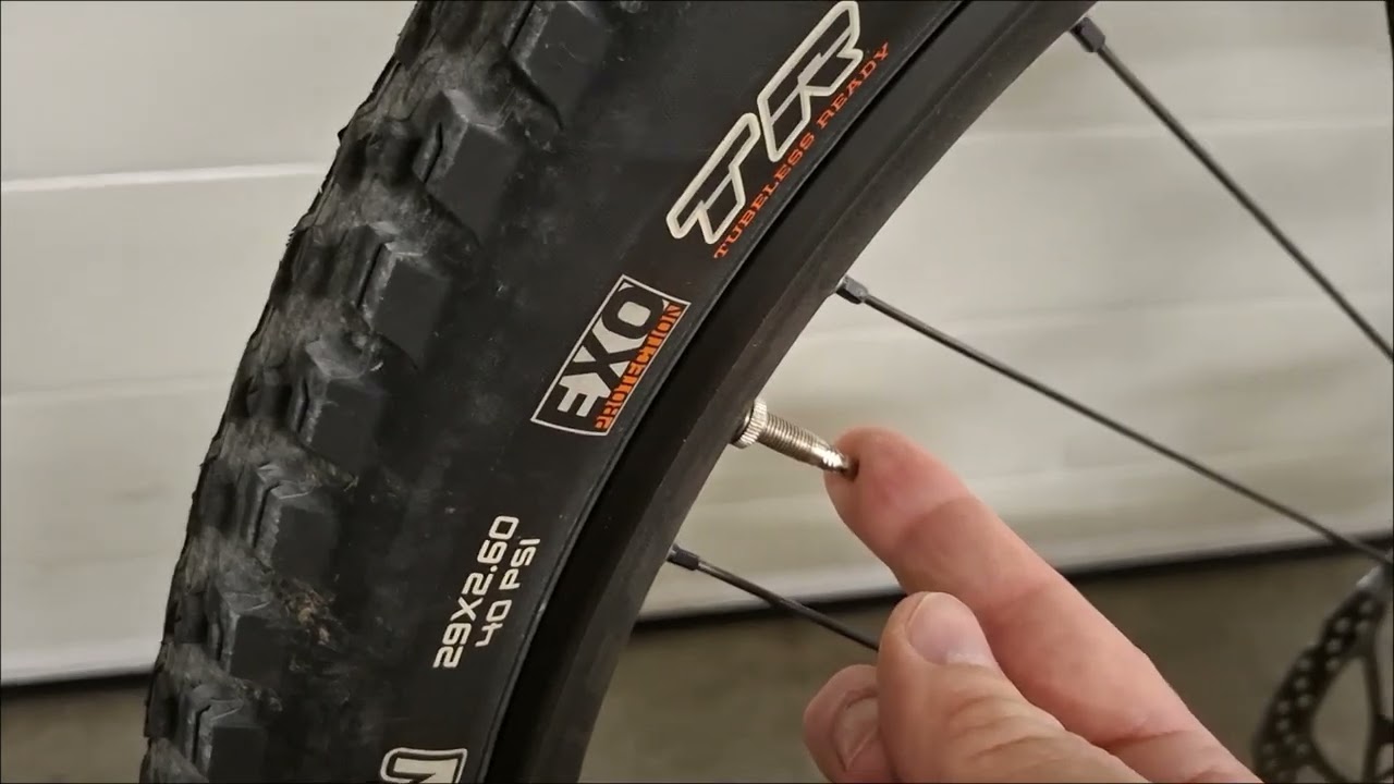 Deflate a girl's bike tire for flexing