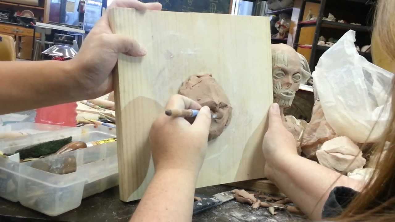 Sculpting a mouth in clay