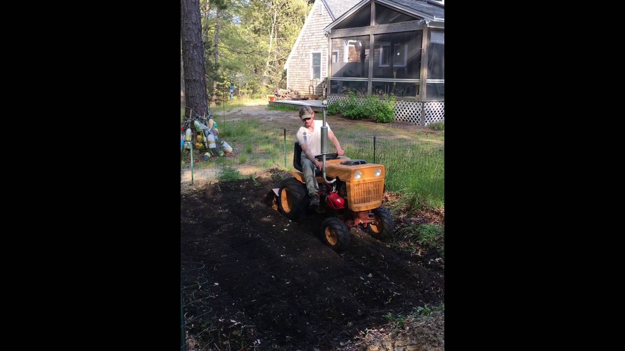 Bolens 1050 garden tractor, restored with Diesel engine. Running the tiller attachment