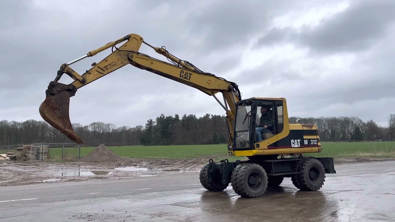 Caterpillar M312 Mobile Excavator - Year: 1999 (Refnr. BM4344)