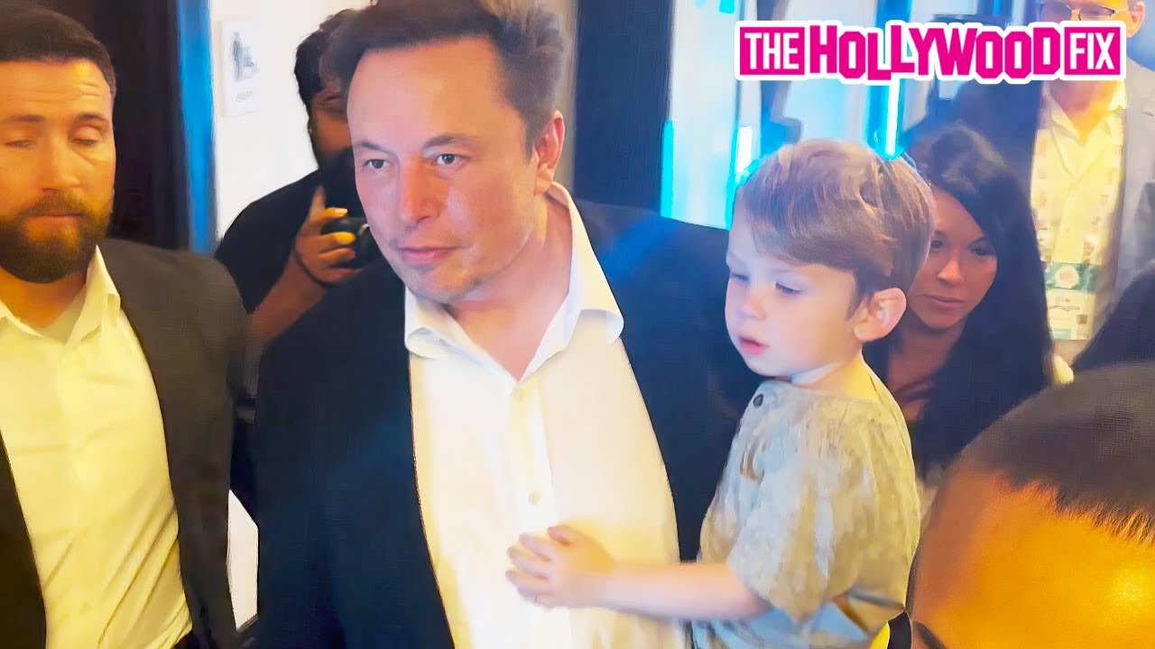 Elon Musk & His Son X AE A-XII Are Swarmed By Fans & Paparazzi Before Speaking At The Possible Event