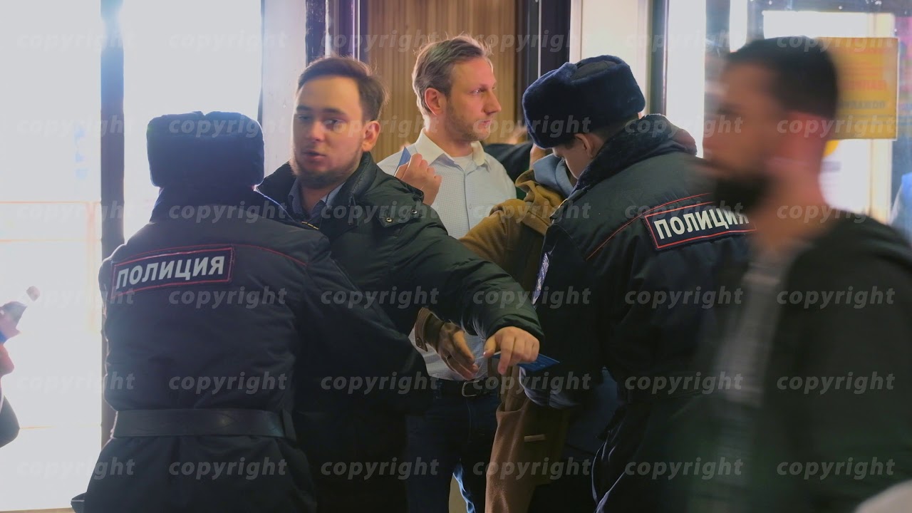 Police security check at the entrance to the hall