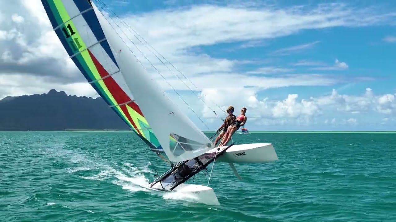Three Hobie Cats racing around Hawai'i