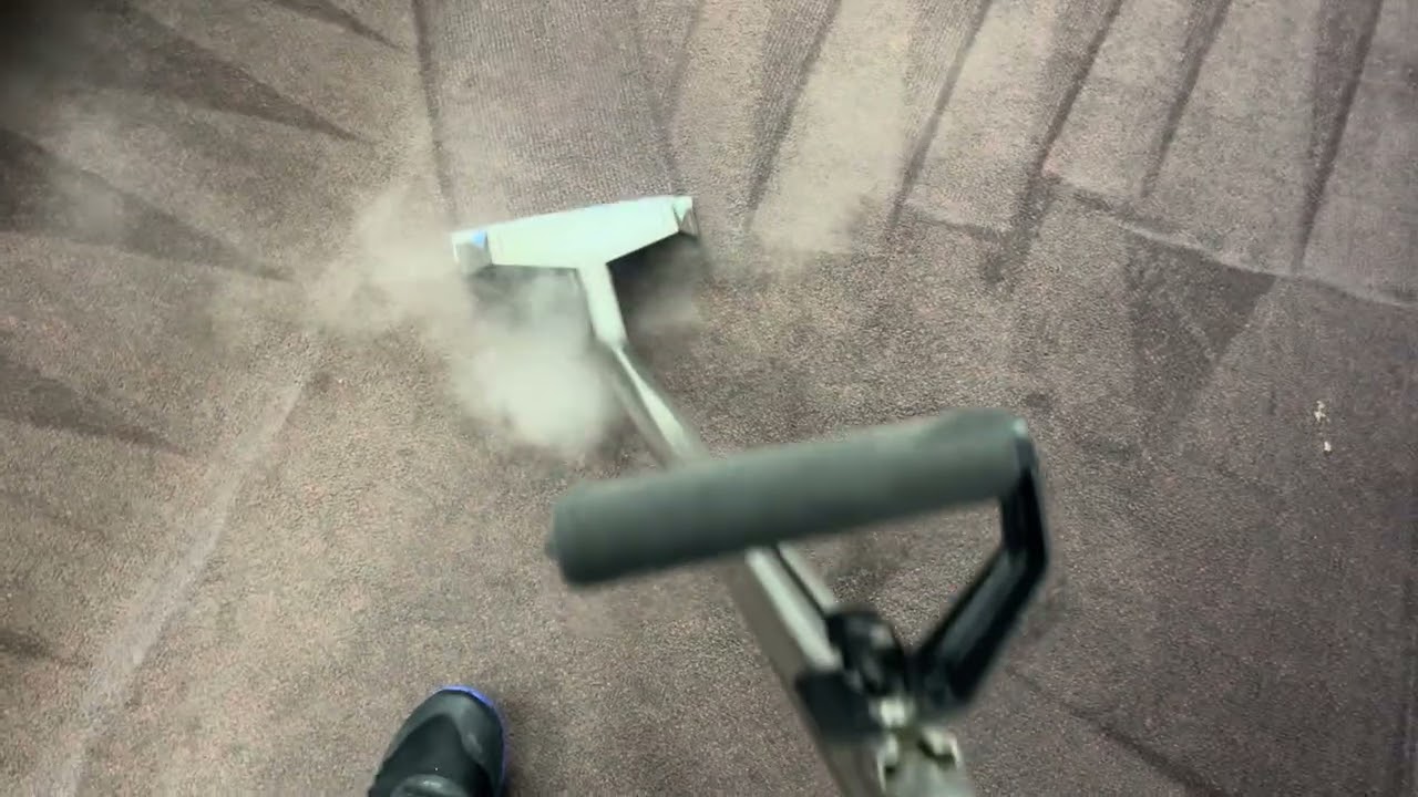 Steam cleaning some carpet for a repeat customer.