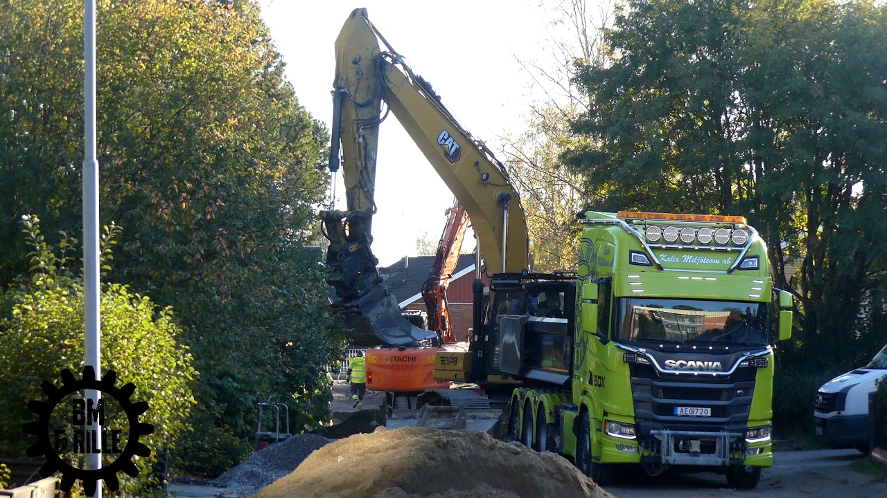 CAT 330NG  and a Hitachi ZX140W with Rototilts in work  and a Scania R590 8x4 V8