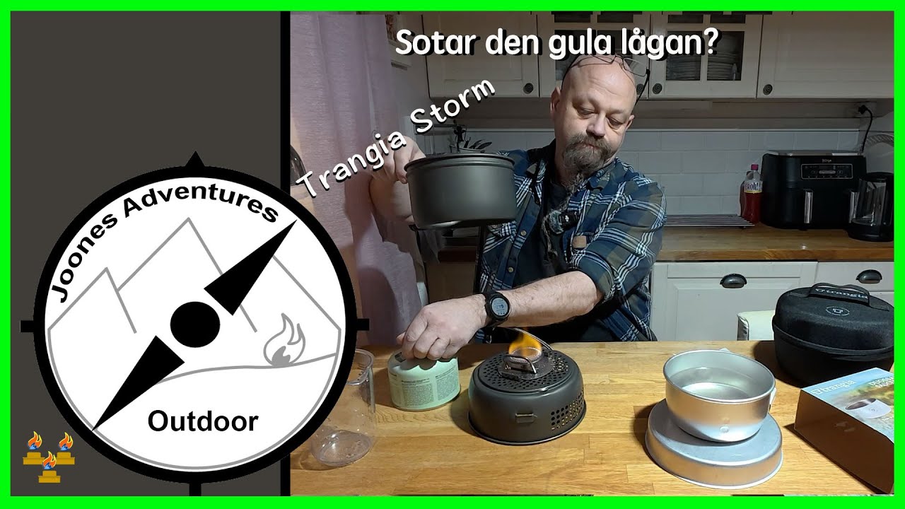 Trangia Storm med gul låga, sotar den mer än Trangia GB 74