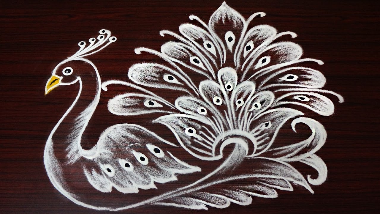 Beautiful Peacock rangoli design freehand | simple ,small and unique peacock rangoli | mayil kolam
