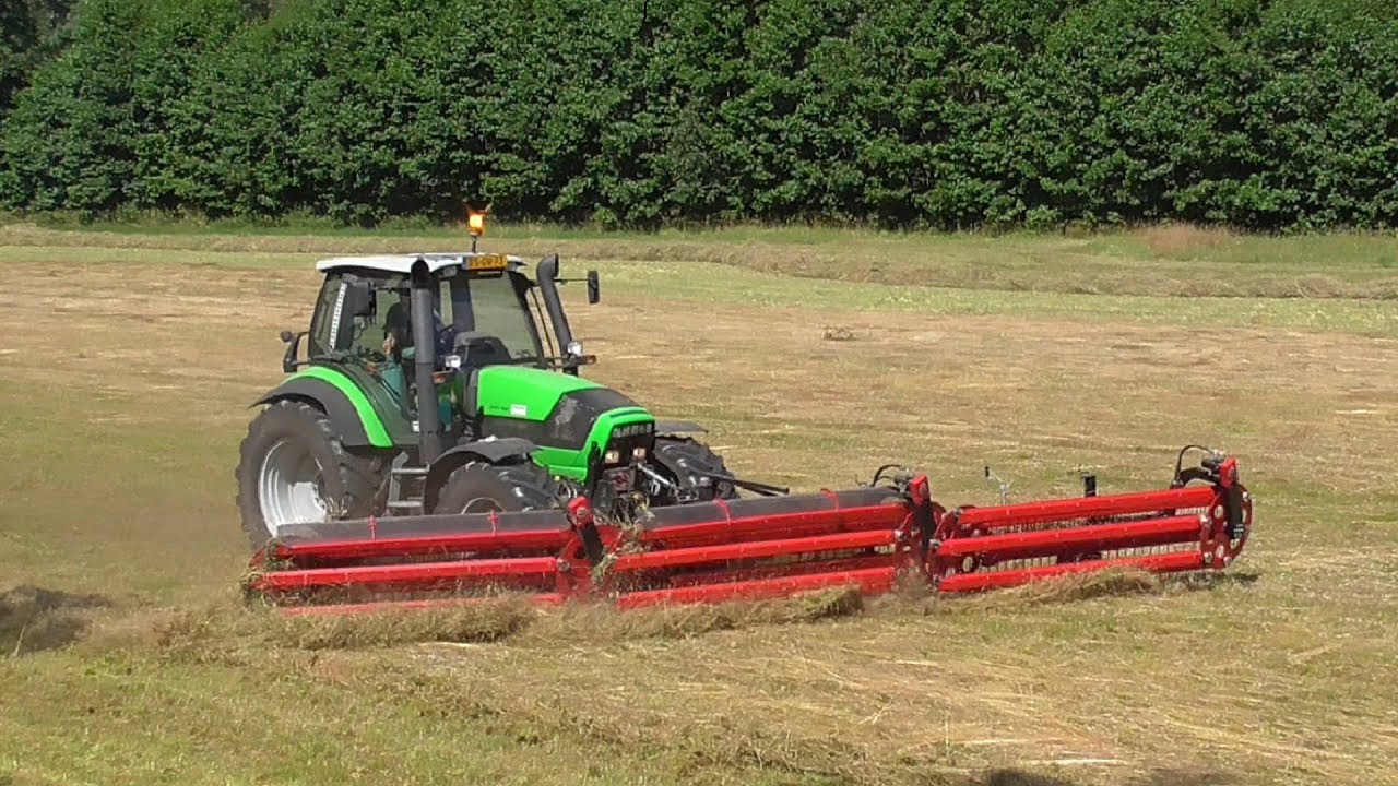 Front mounted comb side-delivery rake!