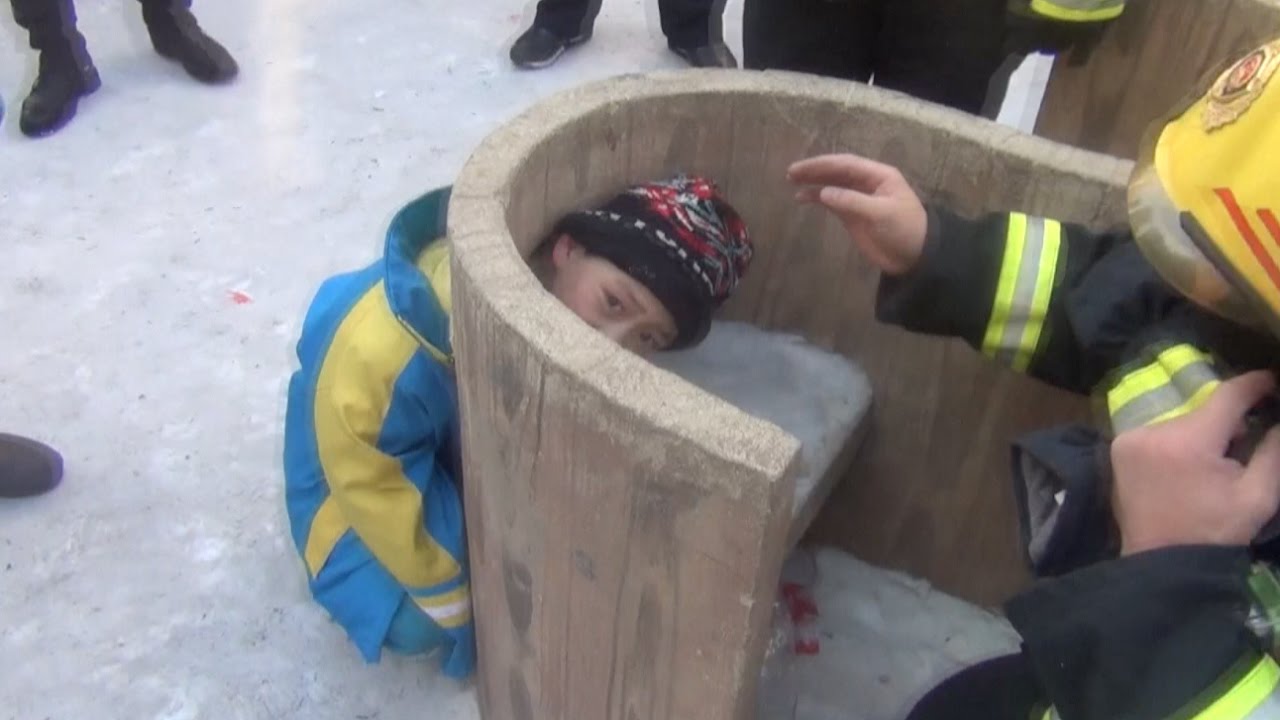 Firefighters Rescue Boy Stuck in Stone Bench