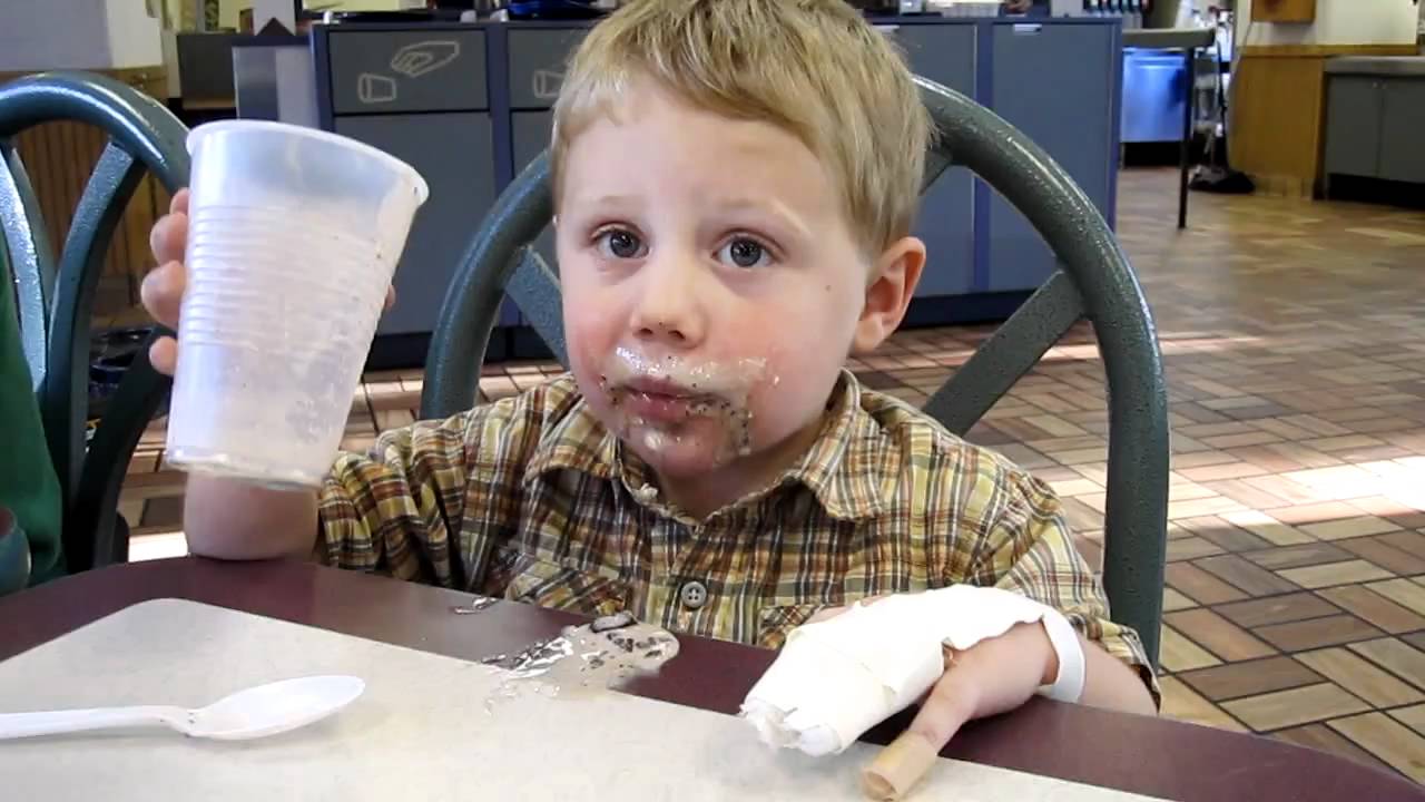 Boy LOVING his milk shake at Burger King