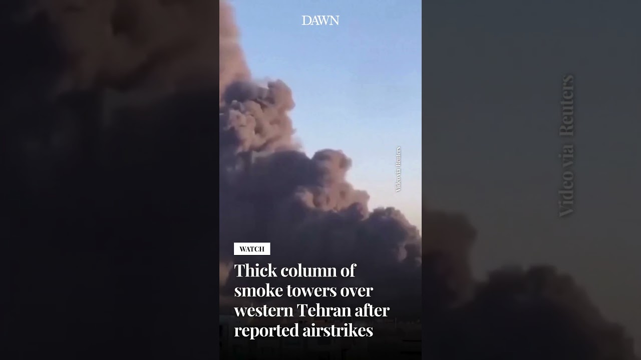 Thick column of smoke towers over western Tehran after reported airstrikes