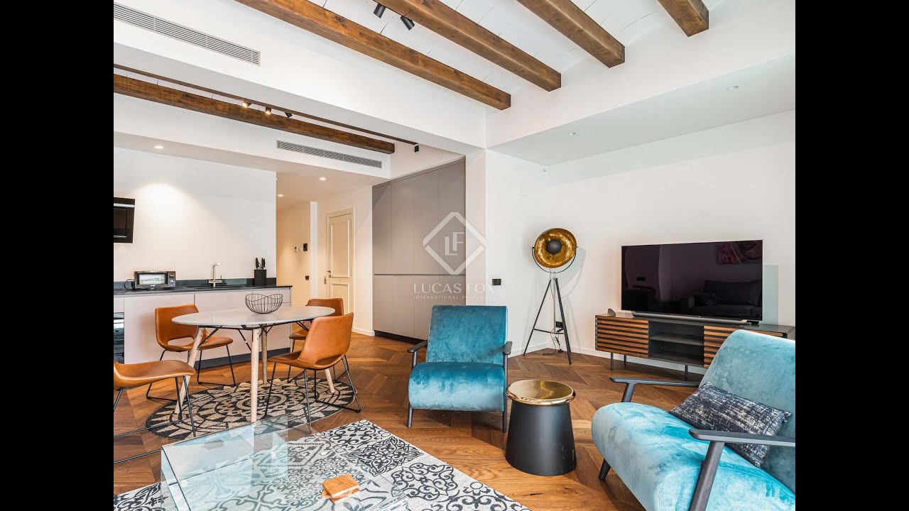 *SOLD* Wonderful apartment with open plan living space and a terrace for sale in Gracia.