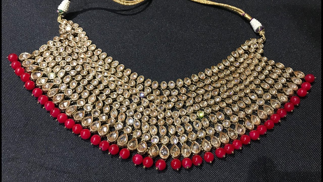 Red wedding jewellery original reverse ad @7343/-