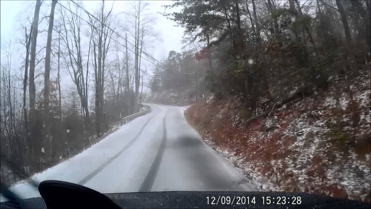 Climbing up to icy Ski view Drive, Gatlinburg Tennessee, while snowing.
