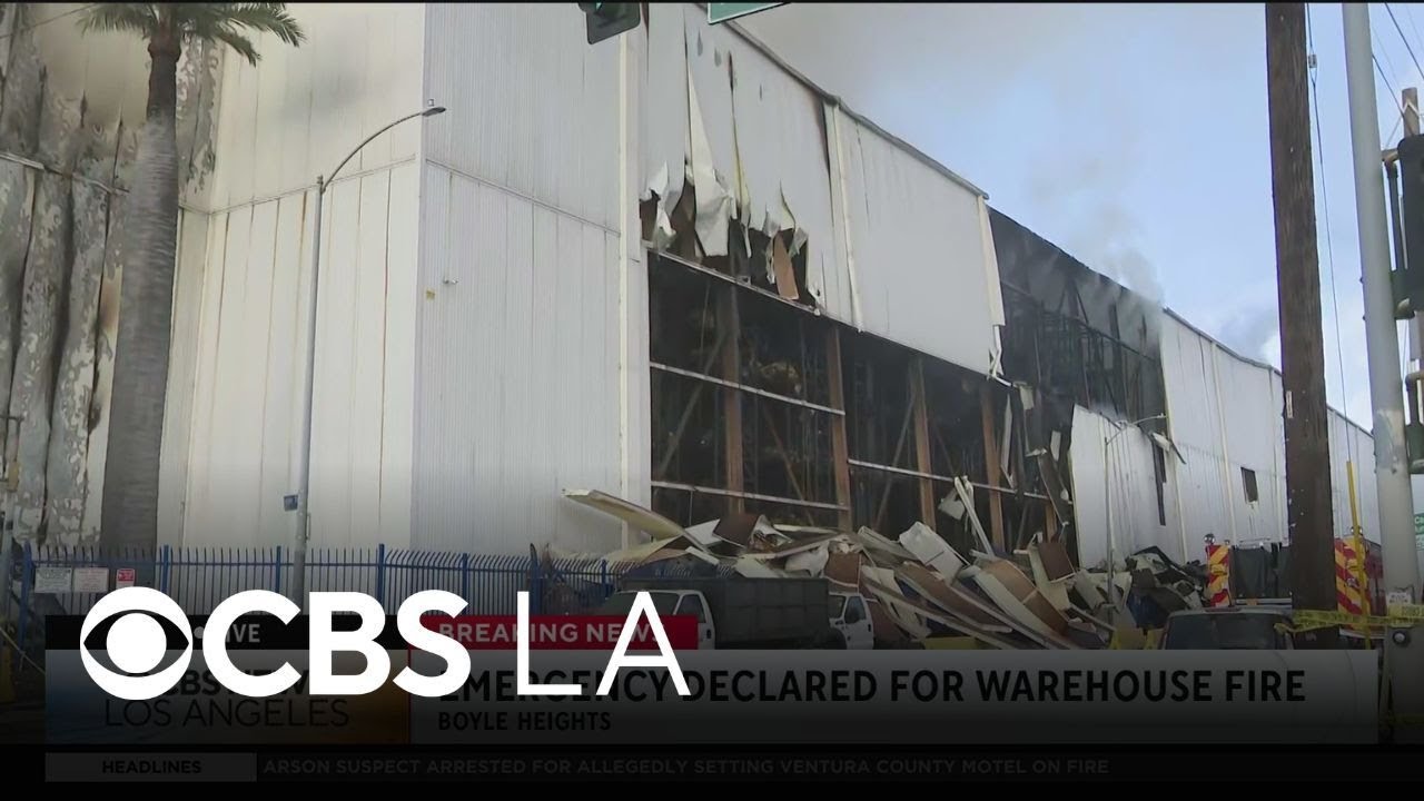 Smoke continues to grow Sunday morning from the Boyle Heights warehouse fire