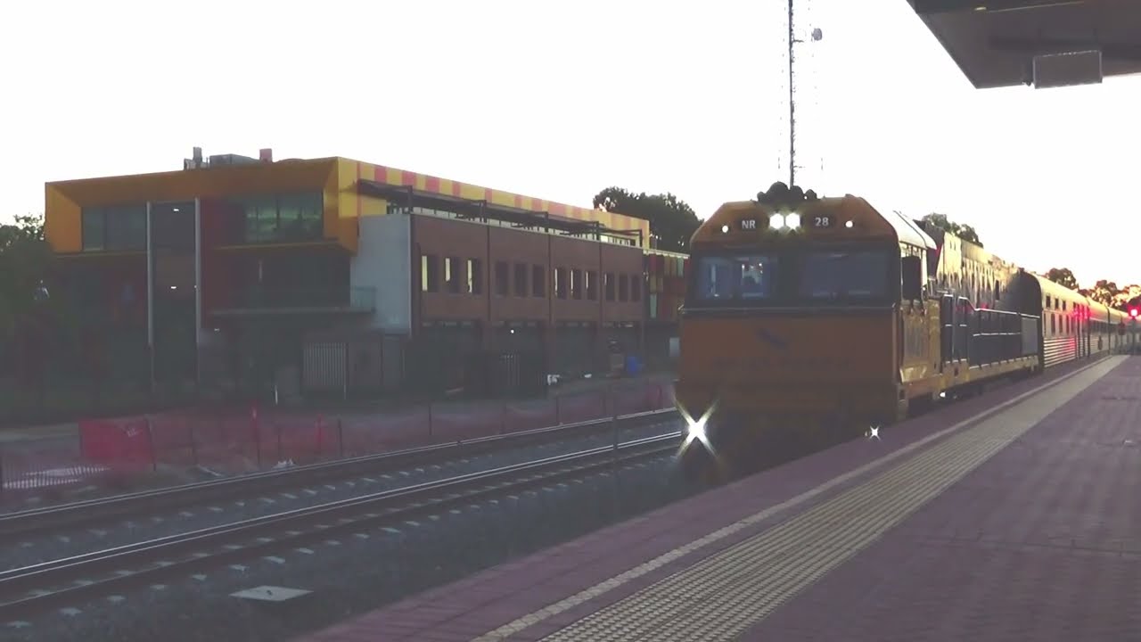 NR 28 with the eastbound Indian Pacific halts at the red signal at MIDLAND station. 18:42 hrs.