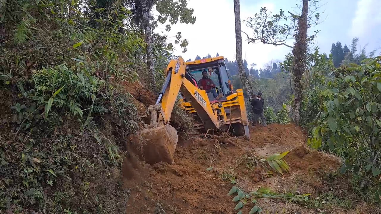 JCB Backhoe Clearing the Ground and Excavator Leveling the Surface