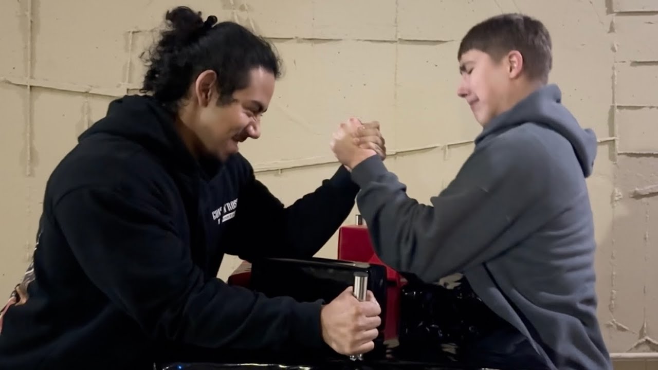Can 4 students beat UCLA’s STRONGEST Arm Wrestler?!?!