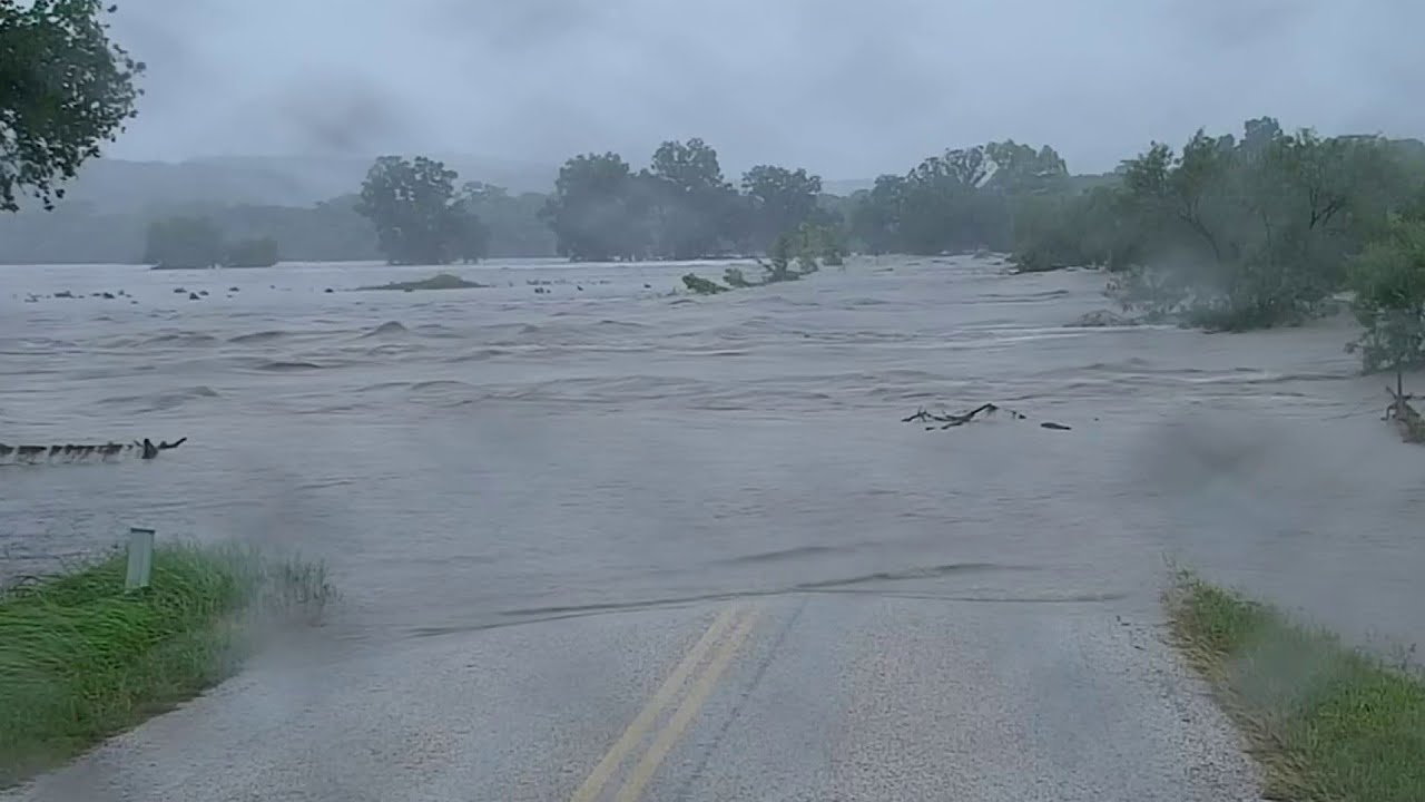 KSAT's Alex Gamez captures Guadalupe River covering road in Comfort
