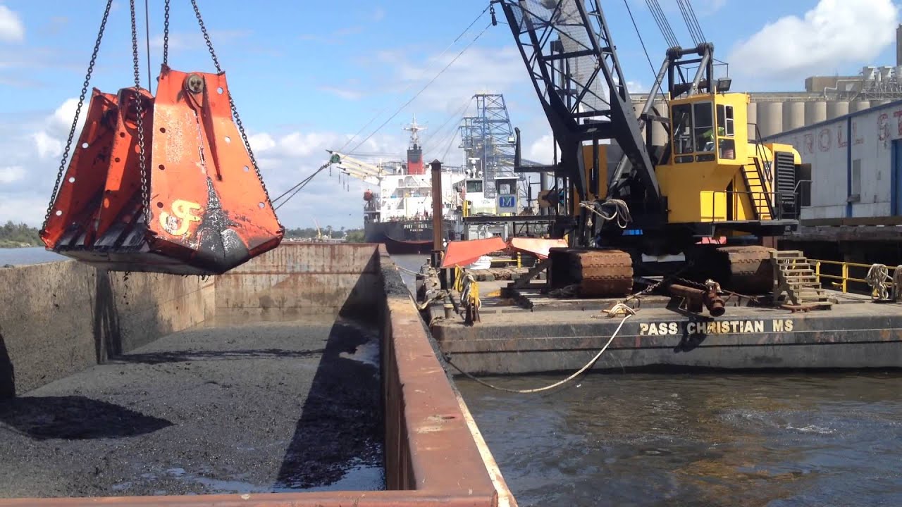 Dockside dredging with 16 cy level cut bucket