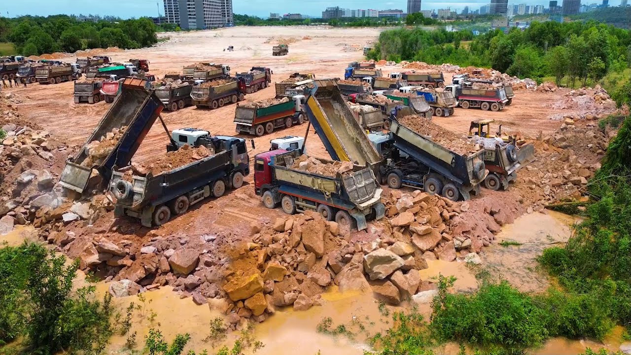 Fantastic HugeLand Reclamation Process Dump Truck Management Unloading Rock Dirt Dozer Push Big Rock