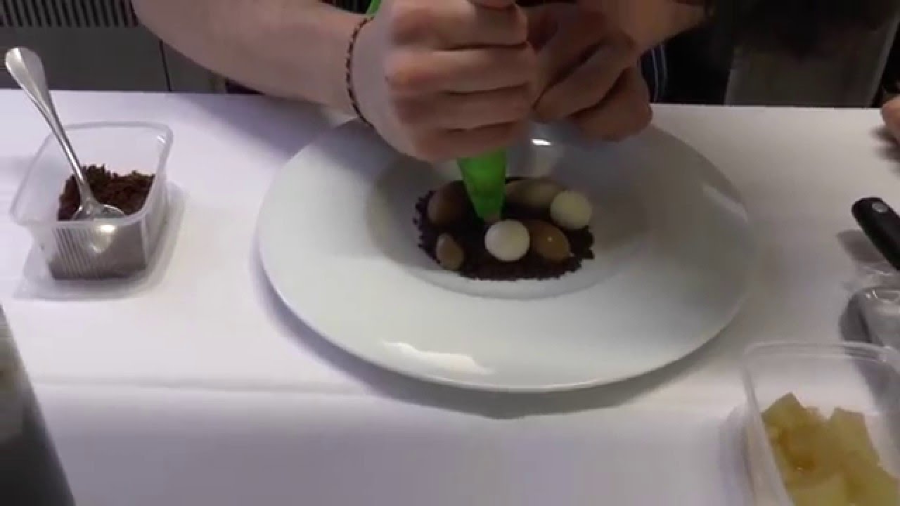 Olivier de Vinck prepares a dessert with pear and chocolate at the Michelin star Kommilfoo