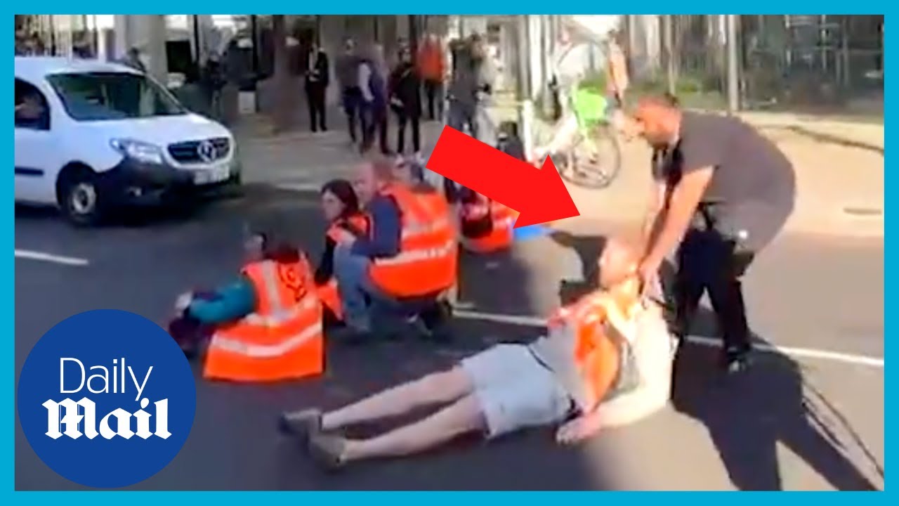 Furious Londoners drag Just Stop Oil activists out of road