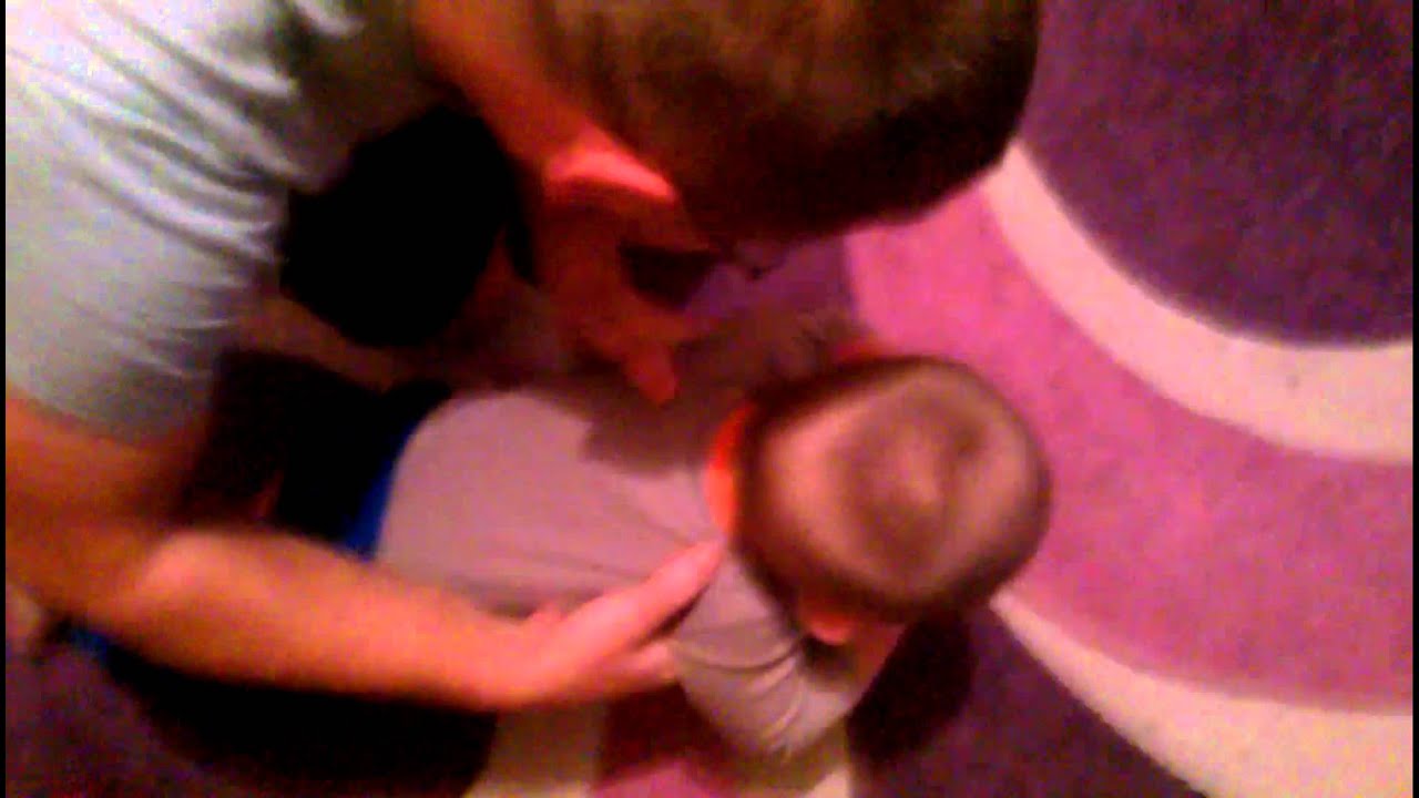 Baby doing push-ups with his father