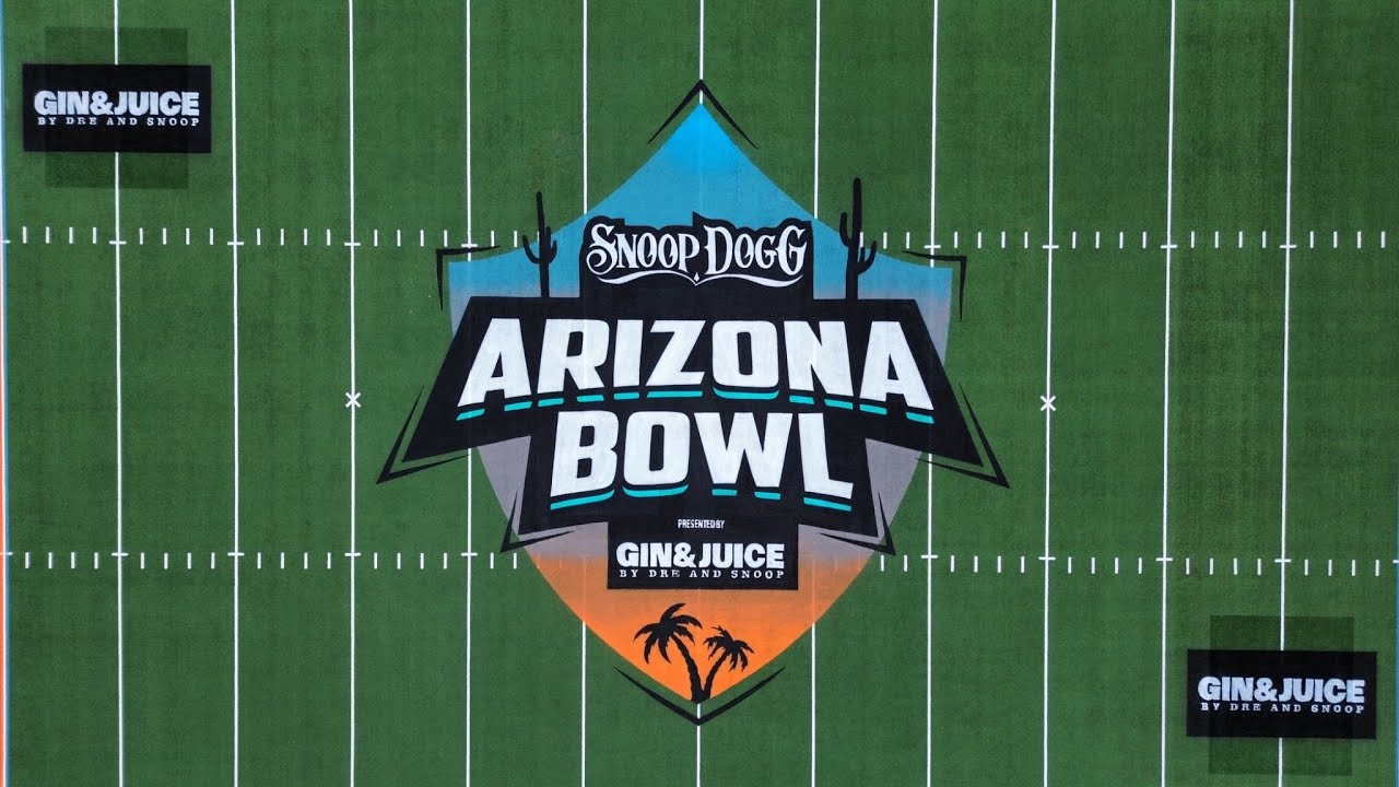 Painting the most WILD logo I've put on a football field for SNOOP DOGG