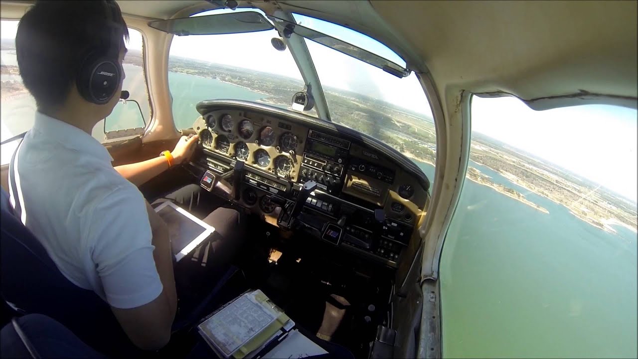 Waco Reg KACT touch&go Approaching above lake
