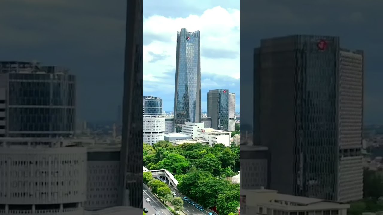 Jakarta city skyscraper building drone video beautiful dey night view Indonesia 2026