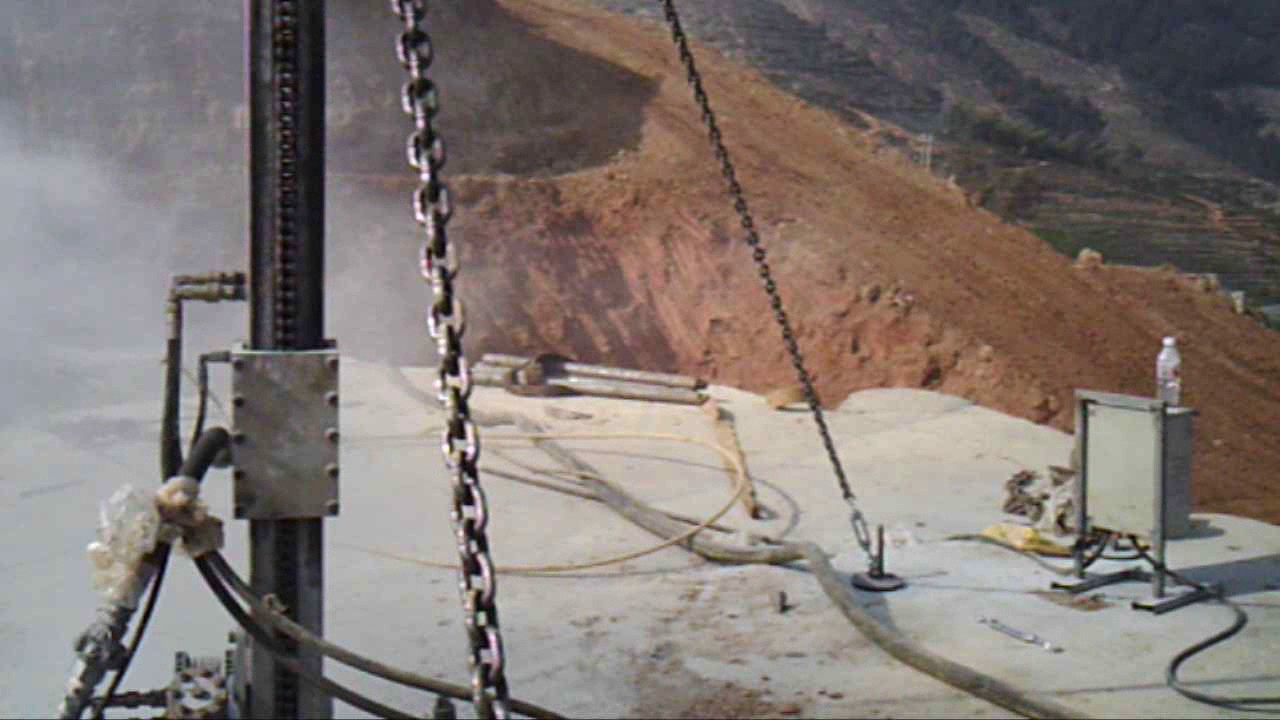 Pneumatic & hydraulic DTH Drilling machine for vertical drilling