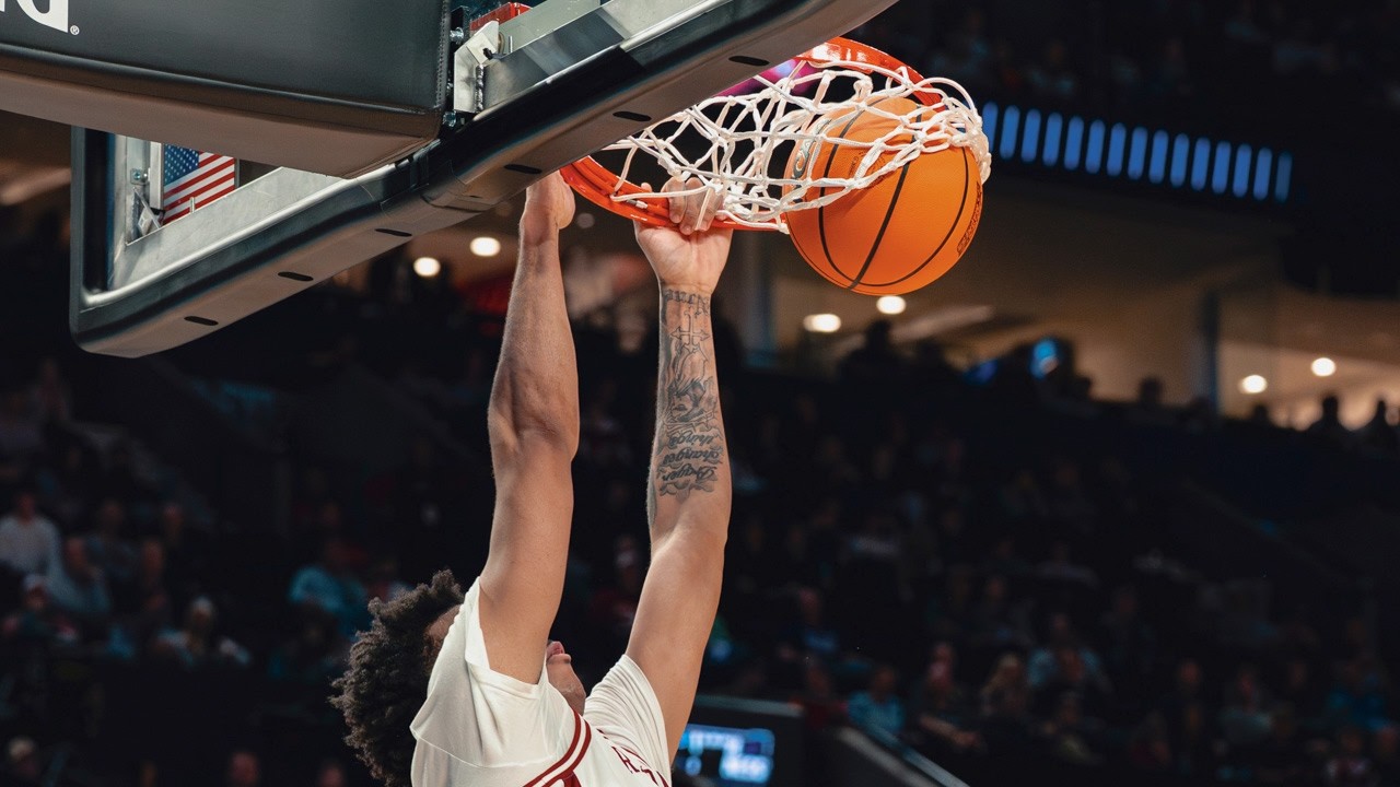Razorbacks' Malique Ewin, Trevon Brazile with John Calipari after win
