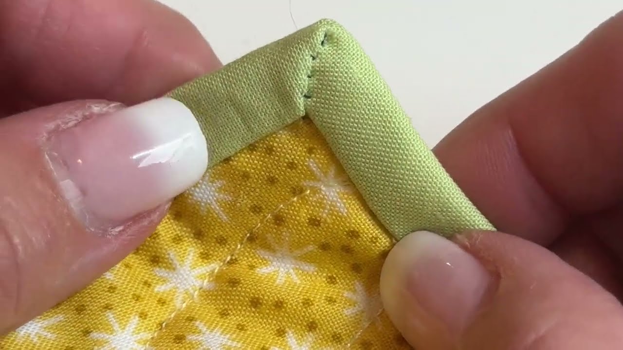 Two Minute Quilter: Hand-stitch mitered binding corners
