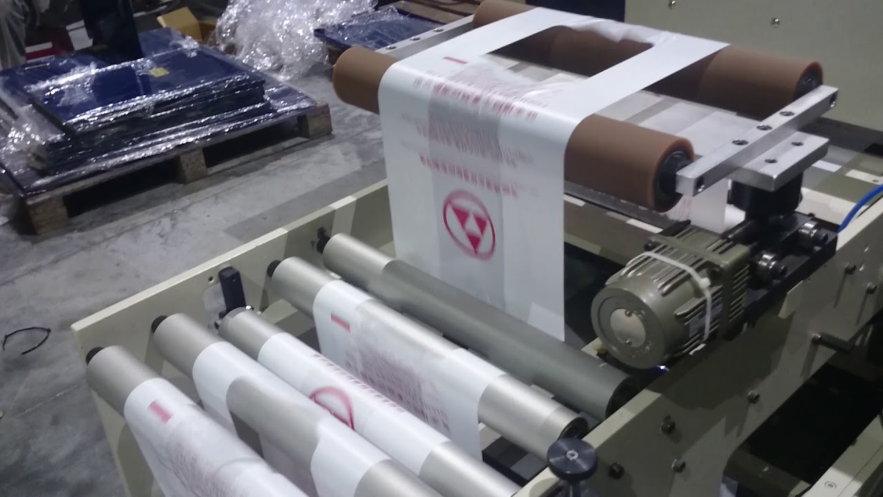 Fully Automatic High Speed 2 Line T Shirt Bags On Roll Making Machine(STBSR-40) - COSMO MACHINERY