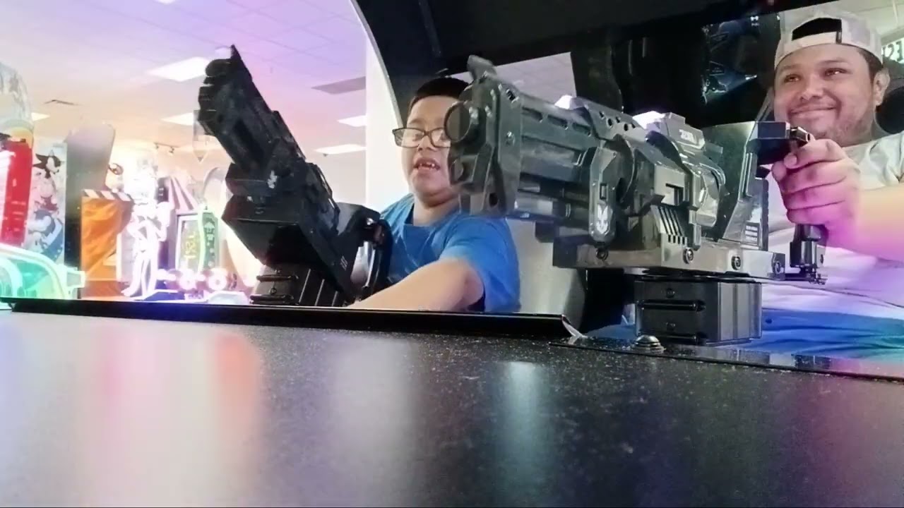 Olibear & Dad Playing halo Arcade game in Chuckeecheese