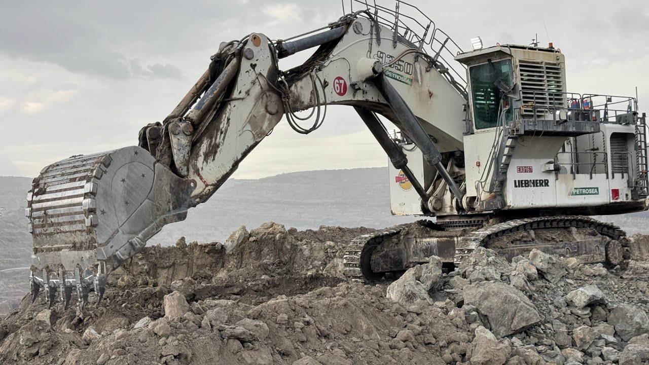 Big Excavator Liebherr R9350 in action || Loading over burden on Caterpillar Dumper ~ Miningstory 