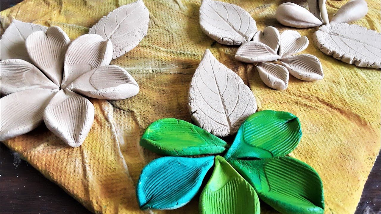 Try this beautiful flowers/wallputty art work/ claycrafts/putty work