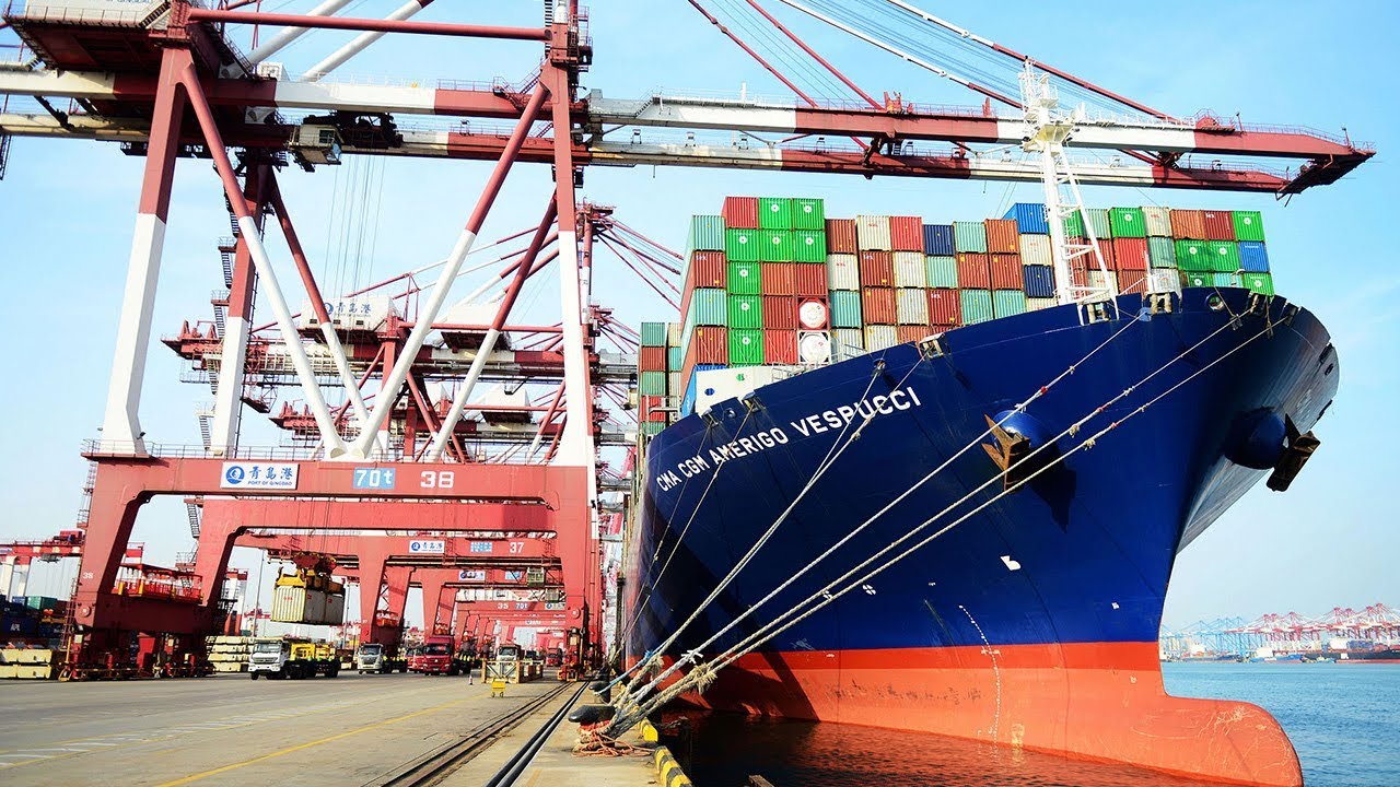 China lowers import tariffs, broadens market access