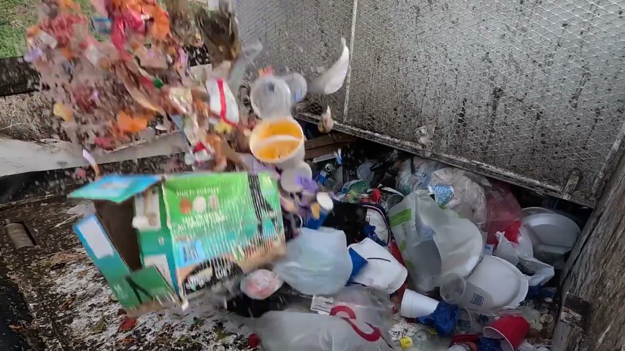 Garbage Truck Hopper POV on Loose Wet Garbage