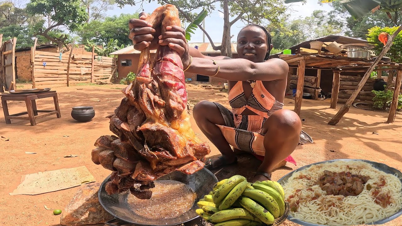Frying Huge Marinated Cow leg in hot Oil To make African Village delectable Stew