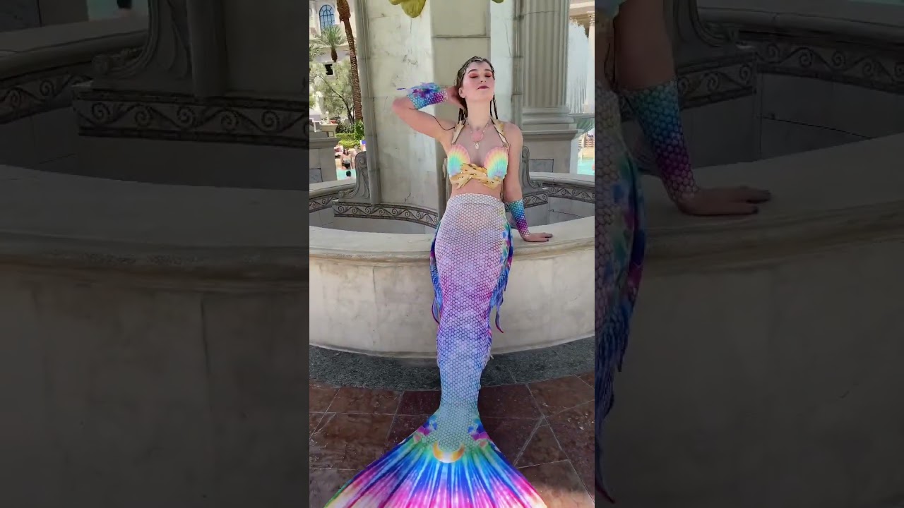 Rainbow mermaid splashing by a fountain 🌈✨ #mermaidtail
