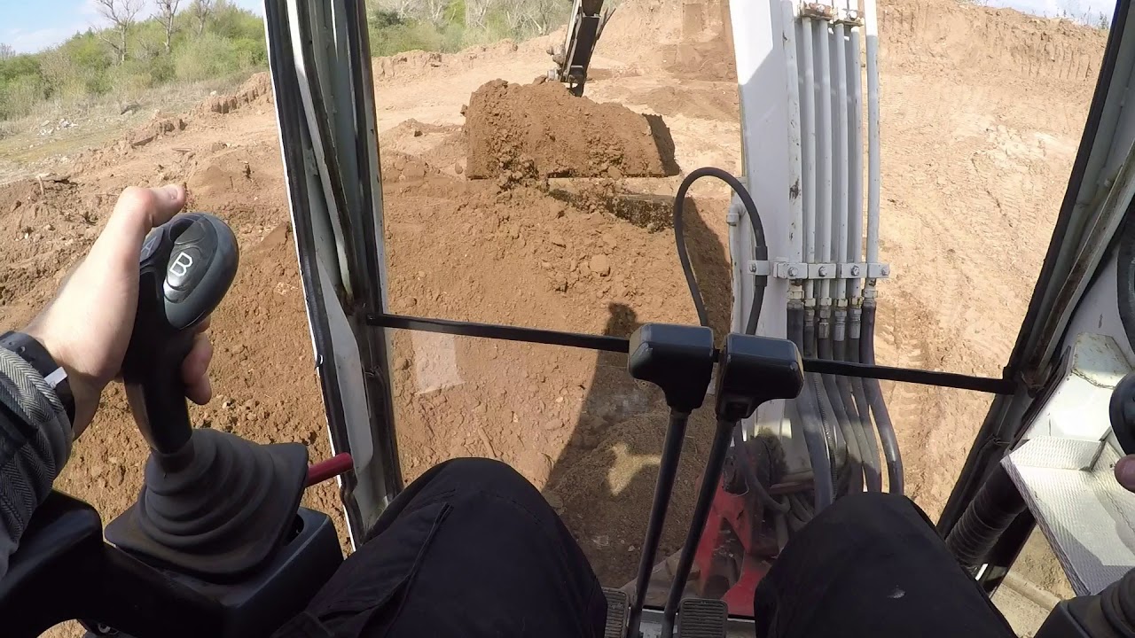 Takeuchi loading Topsoil