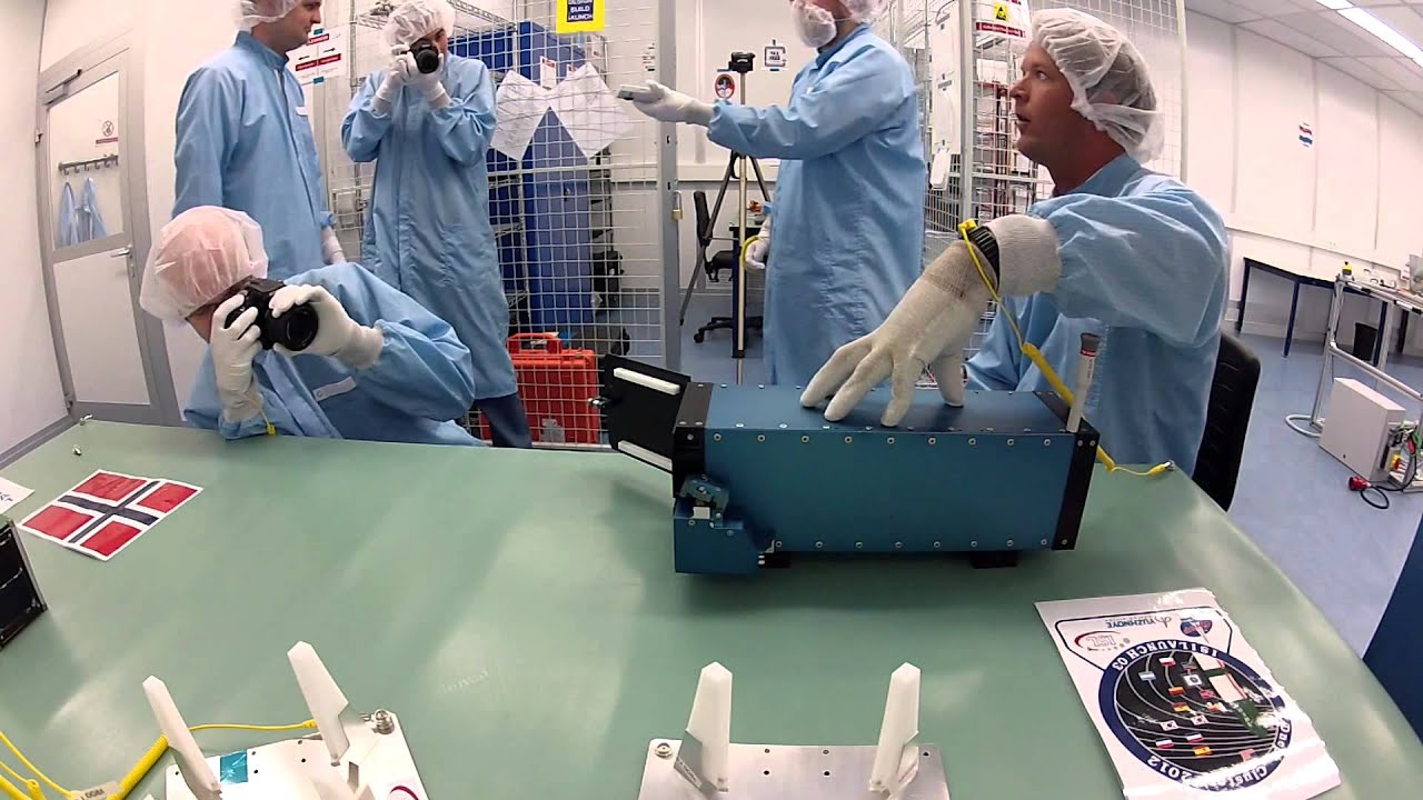 Loading the ISILaunch03 ISIPOD with ZACUBE-1, FUNcube-1 and HiNcube