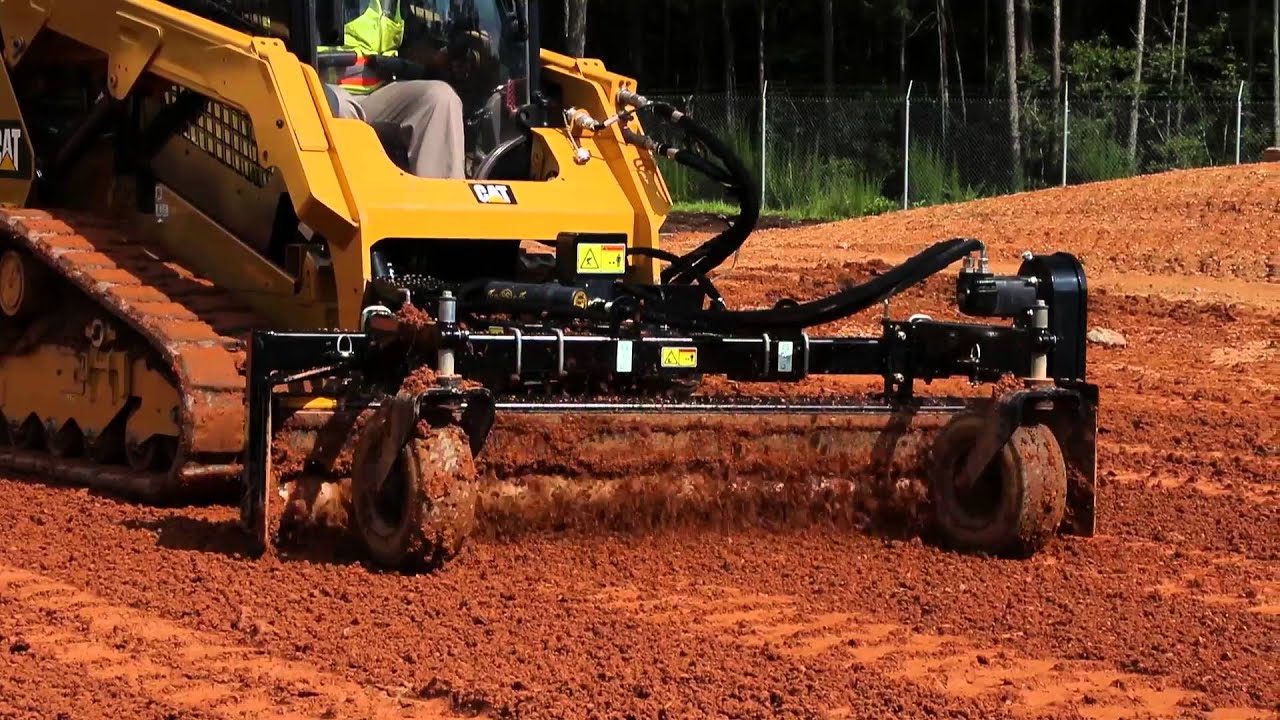 Cat&reg; Power Box Rake Attachment at Work