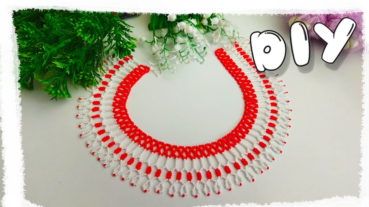 SIMPLE NECKLACE made of beads in red and white colors